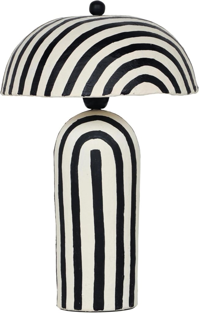 This black striped table top lamp provides a fun addition to any room.