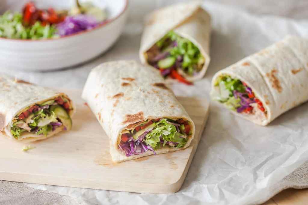 Tortilla wraps filled with chicken and vegetables.